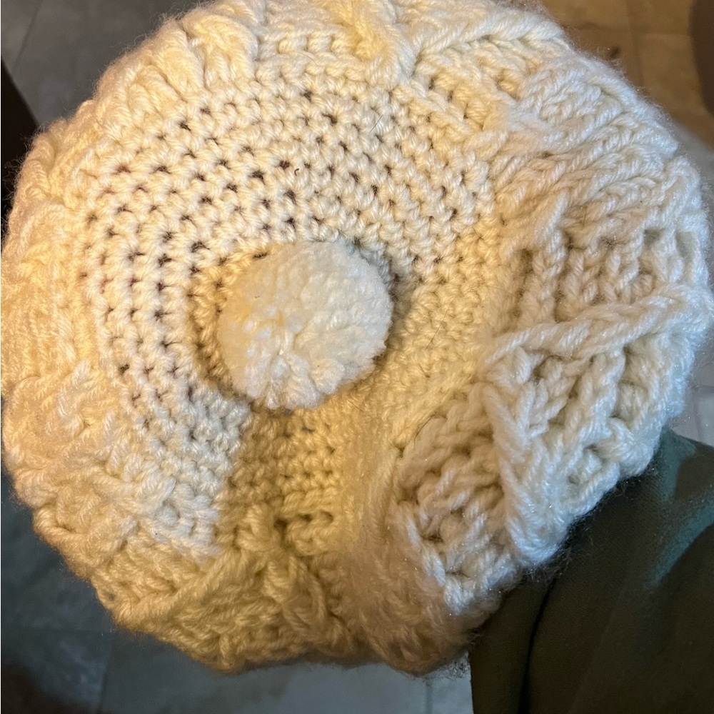 Vintage knit 100% acrylic beret color is cream pom-pom in center of hats